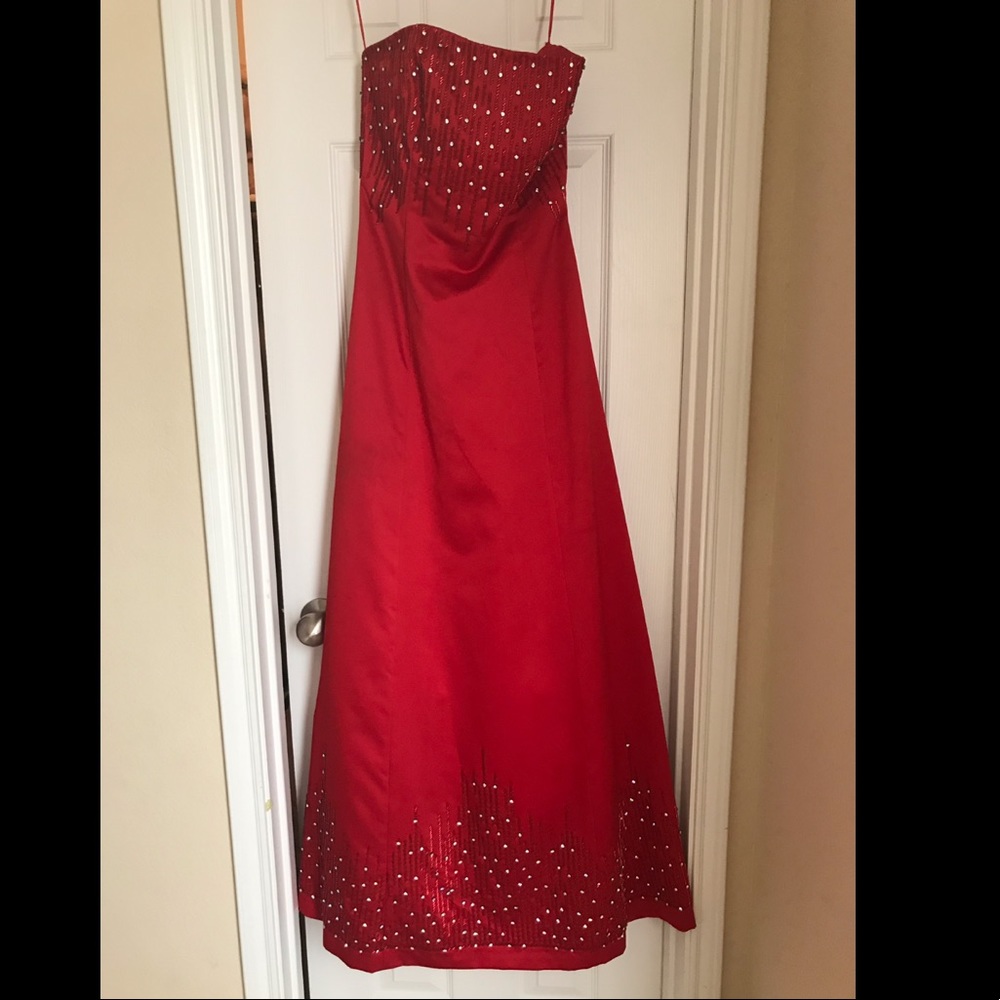 Red strapless beaded gown